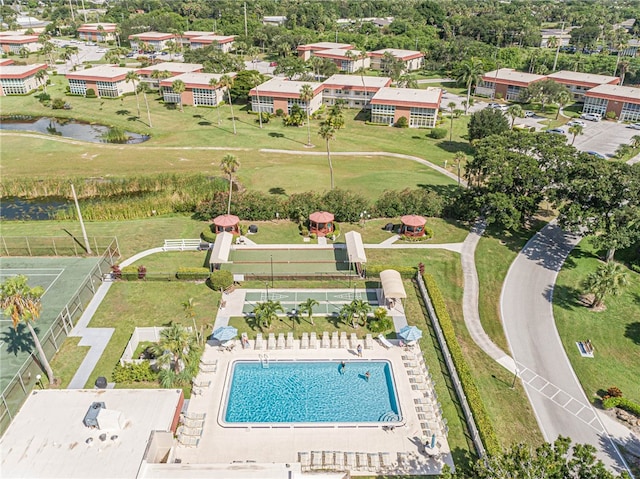 birds eye view of property with a water view