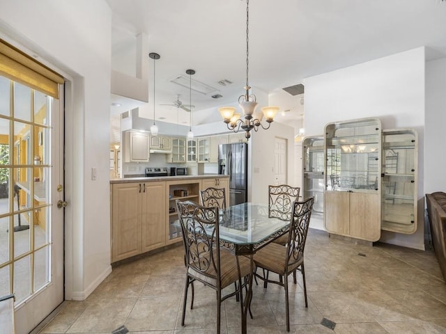 77 Joy Haven Dr, Sebastian, FL 32958 - dining space with a chandelier, plenty of natural light, and a ceiling fan