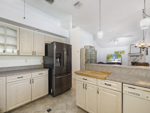 77 Joy Haven Dr, Sebastian, FL 32958 - kitchen featuring stainless steel refrigerator with ice dispenser, white dishwasher, ceiling fan, glass insert cabinets, and a fireplace