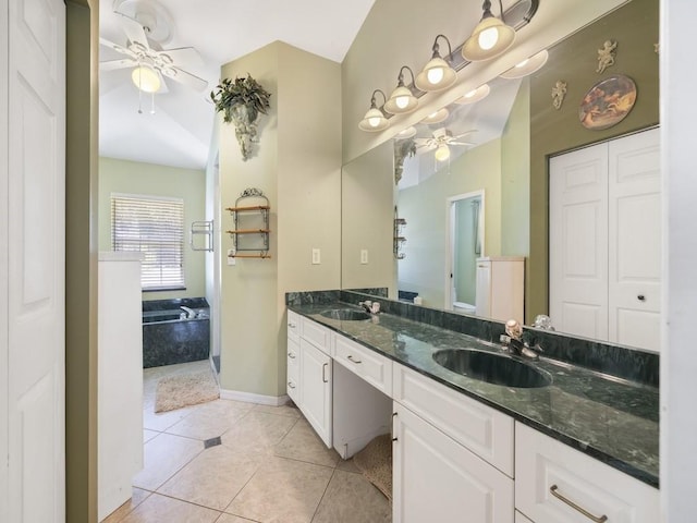 77 Joy Haven Dr, Sebastian, FL 32958 - bathroom with ceiling fan, double vanity, a garden tub, and tile patterned flooring