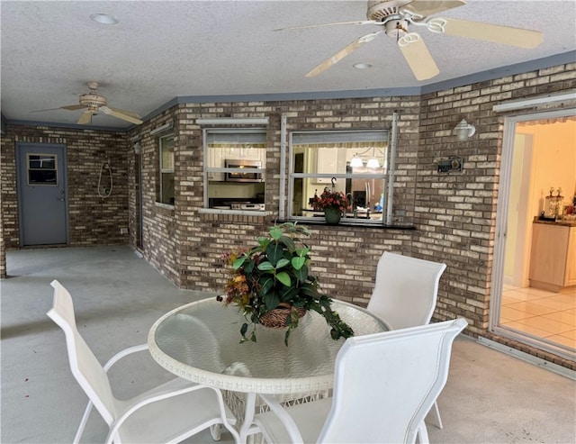 interior space featuring a ceiling fan and outdoor dining area