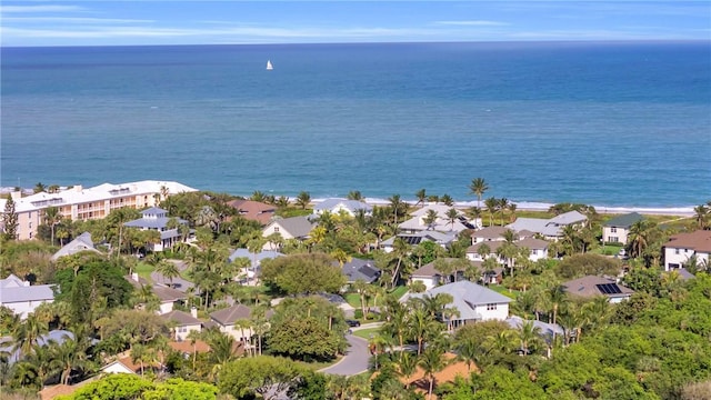 birds eye view of property featuring a water view and a residential view