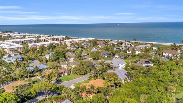 birds eye view of property with a water view and a residential view