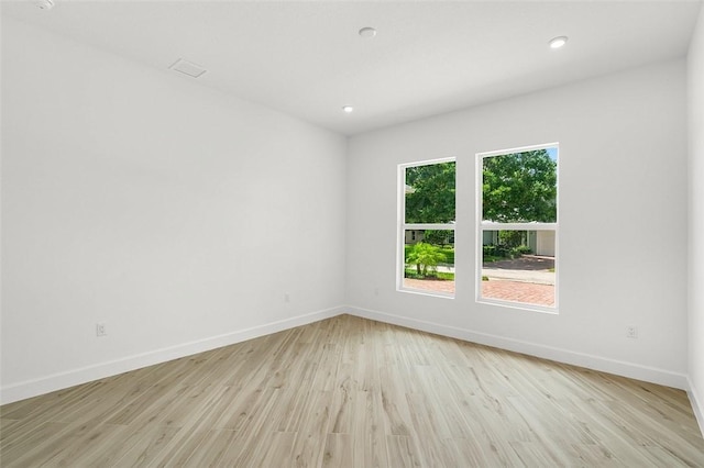 1090 Buckhead Dr SW, Vero Beach, FL 32968 - empty room with baseboards, light wood finished floors, and recessed lighting