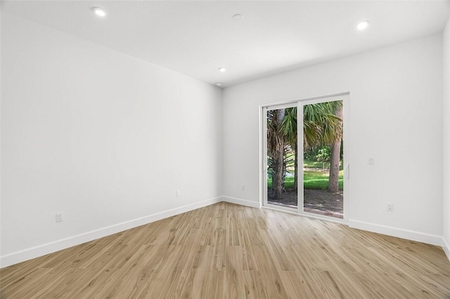 1090 Buckhead Dr SW, Vero Beach, FL 32968 - spare room featuring light wood-style flooring, baseboards, and recessed lighting