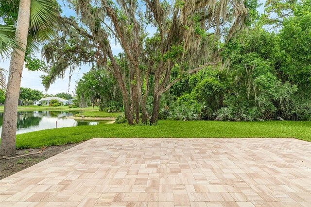 1090 Buckhead Dr SW, Vero Beach, FL 32968 - view of patio with a water view