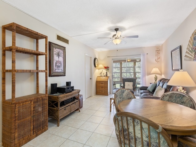 interior space featuring ceiling fan and a textured ceiling