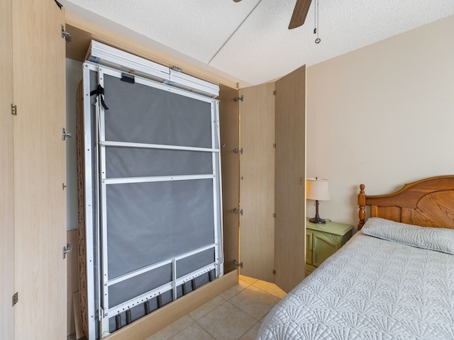 bedroom with light tile patterned floors and ceiling fan