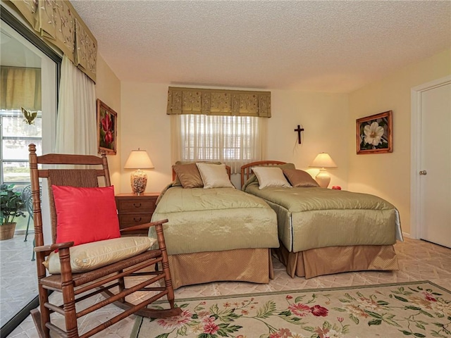 bedroom featuring a textured ceiling