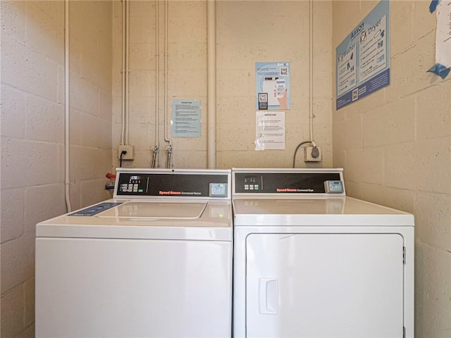 clothes washing area featuring washing machine and dryer