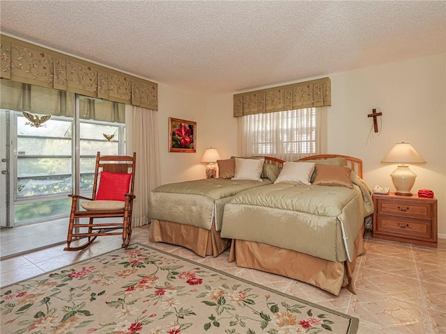 tiled bedroom with a textured ceiling