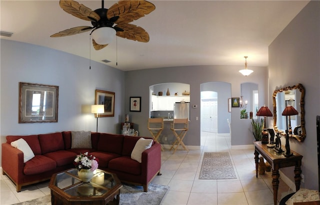 tiled living room featuring ceiling fan