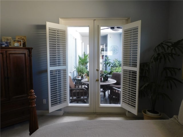 doorway to outside with french doors and light colored carpet