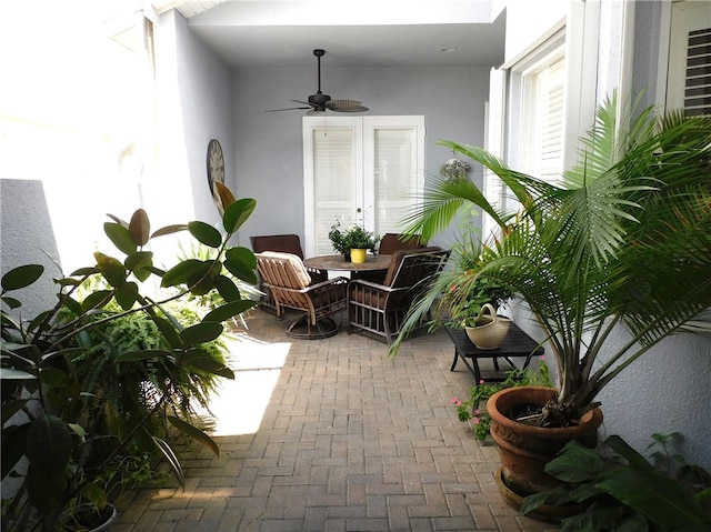 exterior space with french doors and ceiling fan