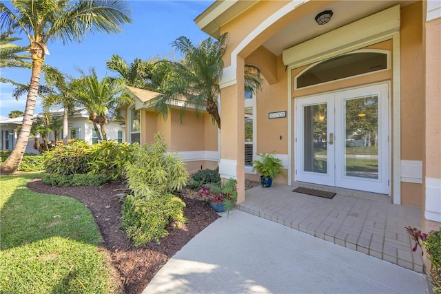 property entrance with stucco siding