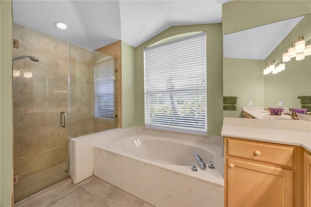 full bathroom with tile patterned flooring, a garden tub, vanity, vaulted ceiling, and a shower stall