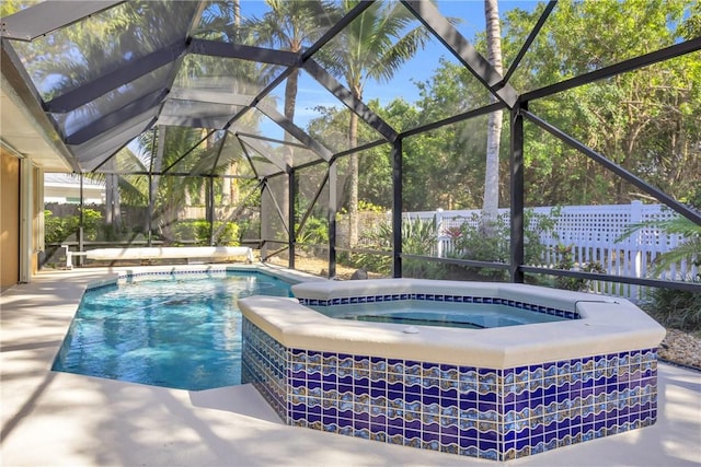 view of pool featuring a fenced in pool, an in ground hot tub, a lanai, fence, and a patio area