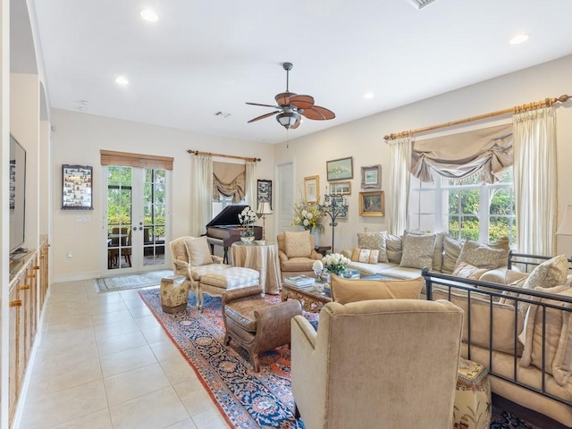 living room featuring french doors, ceiling fan, and light tile patterned flooring