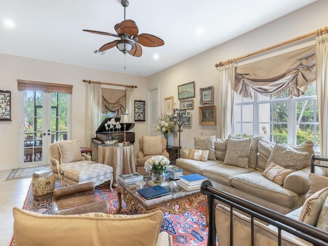 living room featuring tile patterned flooring, ceiling fan, and french doors