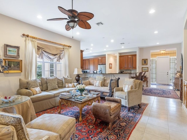 tiled living room with ceiling fan