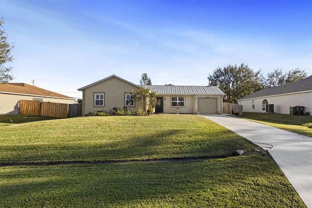 single story home with a garage and a front lawn