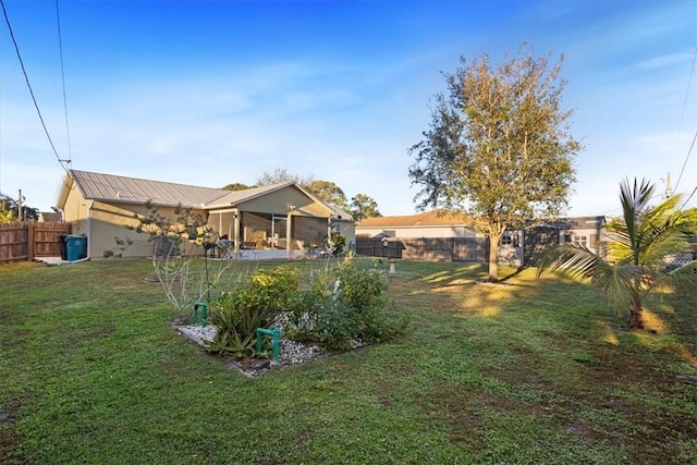 view of yard with a sunroom