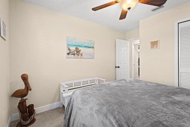 bedroom with carpet flooring, ceiling fan, and a closet