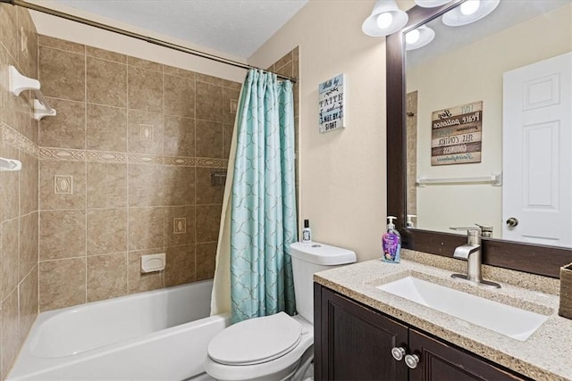 full bathroom with vanity, toilet, a textured ceiling, and shower / tub combo