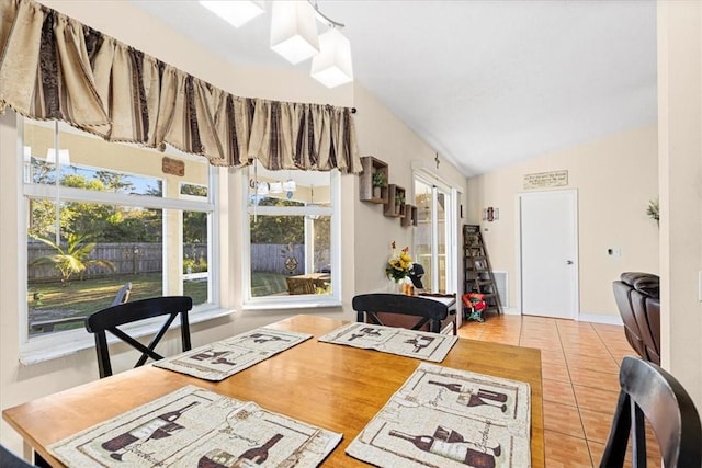 interior space featuring tile patterned floors and lofted ceiling