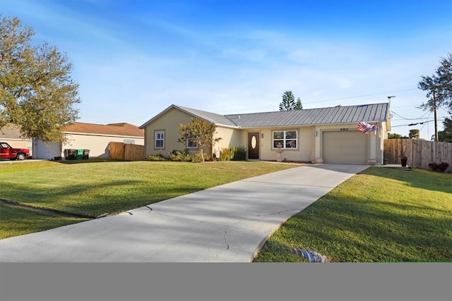 ranch-style home with a garage and a front lawn