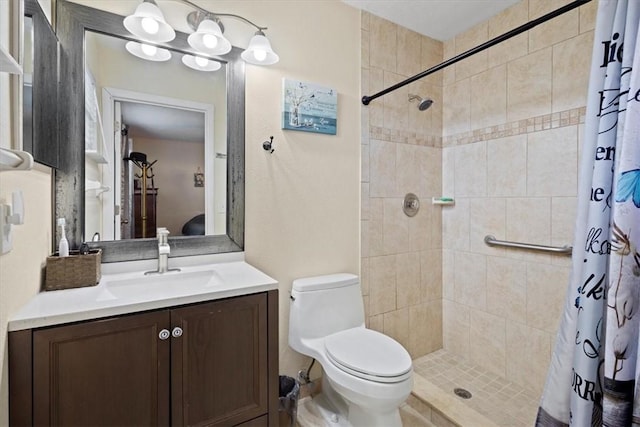 bathroom featuring vanity, toilet, and walk in shower