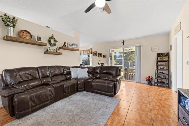 living room with ceiling fan and light tile patterned flooring