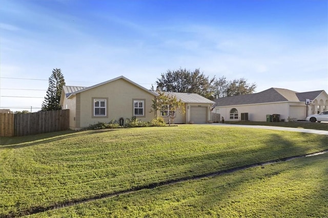 ranch-style home featuring a front yard and a garage