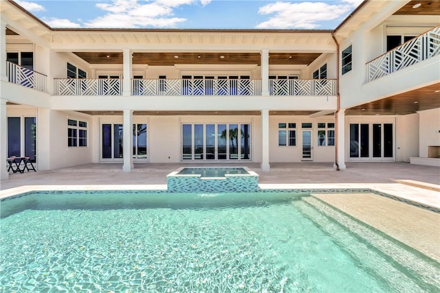 330 N Blue Wave Ln, Vero Beach, FL 32963 - view of swimming pool with a patio area and a pool with connected hot tub