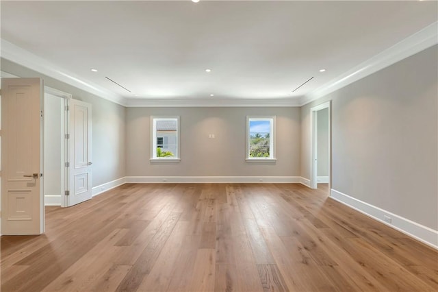 330 N Blue Wave Ln, Vero Beach, FL 32963 - unfurnished room with light wood-style flooring, baseboards, ornamental molding, and recessed lighting