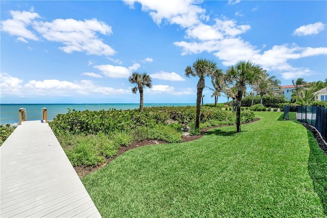 330 N Blue Wave Ln, Vero Beach, FL 32963 - view of home's community with fence, a water view, and a lawn