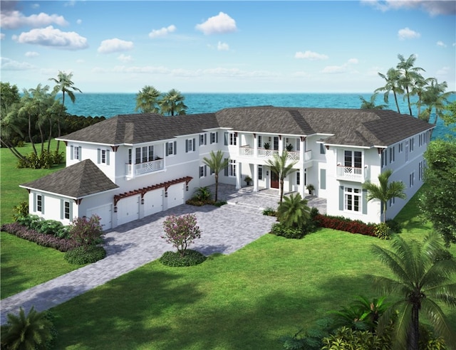 330 N Blue Wave Ln, Vero Beach, FL 32963 - view of front of home featuring an attached garage, a water view, a front lawn, decorative driveway, and a balcony