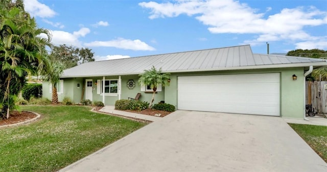 ranch-style home featuring a garage and a front lawn