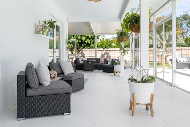 view of patio / terrace with an outdoor living space and fence