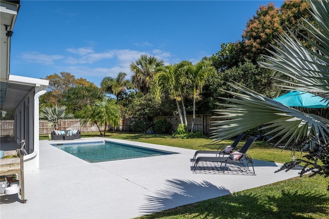 view of swimming pool with a fenced in pool, a lawn, an outdoor hangout area, a fenced backyard, and a patio