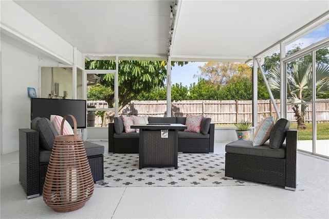 view of patio / terrace with an outdoor living space and fence