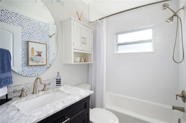 full bathroom featuring vanity, toilet, and shower / tub combo