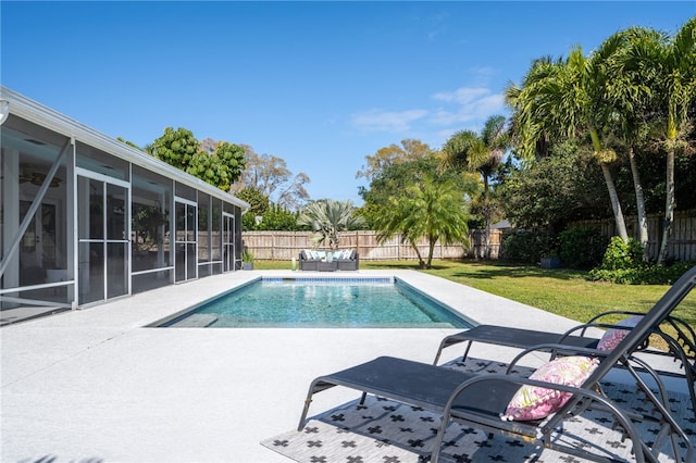 view of pool with a fenced in pool, a fenced backyard, a sunroom, a patio area, and a lawn