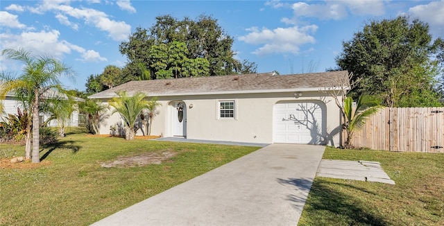 ranch-style home featuring a garage and a front lawn