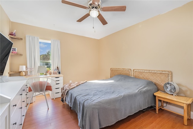 bedroom featuring hardwood / wood-style floors and ceiling fan