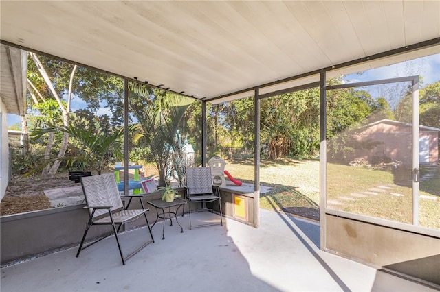 sunroom featuring wood ceiling