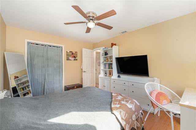 bedroom with hardwood / wood-style flooring and ceiling fan