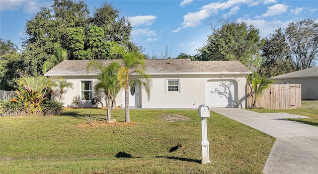 single story home featuring a front yard and a garage