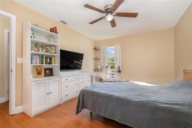 bedroom with ceiling fan and light hardwood / wood-style floors