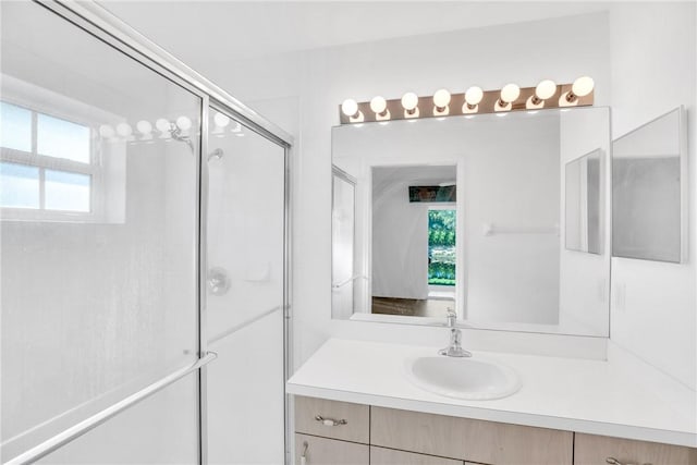 bathroom with vanity and walk in shower